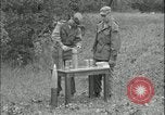 Image of 105mm HE smoke shell leaflet replacement Fort Riley Kansas USA, 1951, second 23 stock footage video 65675078828