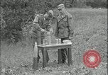 Image of 105mm HE smoke shell leaflet replacement Fort Riley Kansas USA, 1951, second 24 stock footage video 65675078828