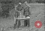 Image of 105mm HE smoke shell leaflet replacement Fort Riley Kansas USA, 1951, second 25 stock footage video 65675078828
