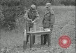 Image of 105mm HE smoke shell leaflet replacement Fort Riley Kansas USA, 1951, second 26 stock footage video 65675078828