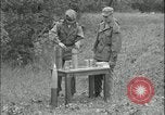 Image of 105mm HE smoke shell leaflet replacement Fort Riley Kansas USA, 1951, second 27 stock footage video 65675078828
