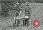 Image of 105mm HE smoke shell leaflet replacement Fort Riley Kansas USA, 1951, second 28 stock footage video 65675078828
