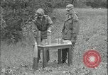 Image of 105mm HE smoke shell leaflet replacement Fort Riley Kansas USA, 1951, second 29 stock footage video 65675078828