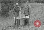 Image of 105mm HE smoke shell leaflet replacement Fort Riley Kansas USA, 1951, second 30 stock footage video 65675078828