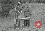 Image of 105mm HE smoke shell leaflet replacement Fort Riley Kansas USA, 1951, second 31 stock footage video 65675078828