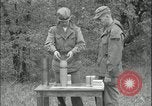Image of 105mm HE smoke shell leaflet replacement Fort Riley Kansas USA, 1951, second 32 stock footage video 65675078828