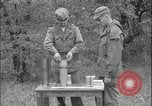 Image of 105mm HE smoke shell leaflet replacement Fort Riley Kansas USA, 1951, second 34 stock footage video 65675078828