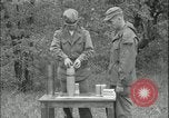 Image of 105mm HE smoke shell leaflet replacement Fort Riley Kansas USA, 1951, second 35 stock footage video 65675078828