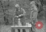 Image of 105mm HE smoke shell leaflet replacement Fort Riley Kansas USA, 1951, second 39 stock footage video 65675078828