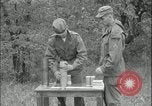 Image of 105mm HE smoke shell leaflet replacement Fort Riley Kansas USA, 1951, second 40 stock footage video 65675078828