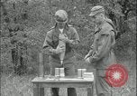 Image of 105mm HE smoke shell leaflet replacement Fort Riley Kansas USA, 1951, second 41 stock footage video 65675078828