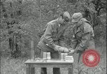 Image of 105mm HE smoke shell leaflet replacement Fort Riley Kansas USA, 1951, second 44 stock footage video 65675078828