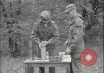 Image of 105mm HE smoke shell leaflet replacement Fort Riley Kansas USA, 1951, second 49 stock footage video 65675078828