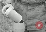 Image of 105mm HE smoke shell leaflet replacement Fort Riley Kansas USA, 1951, second 51 stock footage video 65675078828