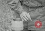 Image of 105mm HE smoke shell leaflet replacement Fort Riley Kansas USA, 1951, second 58 stock footage video 65675078828