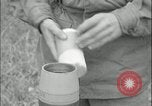 Image of 105mm HE smoke shell leaflet replacement Fort Riley Kansas USA, 1951, second 59 stock footage video 65675078828