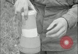Image of 105mm HE smoke shell leaflet replacement Fort Riley Kansas USA, 1951, second 60 stock footage video 65675078828