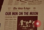 Image of Apollo 11 photos newspaper headlines United States USA, 1969, second 57 stock footage video 65675078852