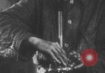 Image of Youth learning to maintain locomotives Germany, 1942, second 50 stock footage video 65675078930