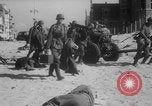 Image of Allied Military equipment and dead soldiers scattered Dunkirk France, 1940, second 28 stock footage video 65675078989