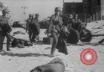 Image of Allied Military equipment and dead soldiers scattered Dunkirk France, 1940, second 29 stock footage video 65675078989