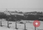 Image of Allied Military equipment and dead soldiers scattered Dunkirk France, 1940, second 43 stock footage video 65675078989