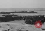 Image of Allied Military equipment and dead soldiers scattered Dunkirk France, 1940, second 48 stock footage video 65675078989