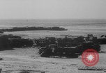 Image of Allied Military equipment and dead soldiers scattered Dunkirk France, 1940, second 49 stock footage video 65675078989