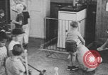 Image of children fighting playroom United States USA, 1971, second 54 stock footage video 65675079018