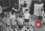 Image of children fighting playroom United States USA, 1971, second 55 stock footage video 65675079018