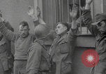 Image of captured German troops frisked Cherbourg Normandy France, 1944, second 6 stock footage video 65675079292