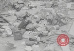 Image of German soldiers dead and scattered equipment Cherbourg Normandy France, 1944, second 3 stock footage video 65675079298