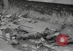 Image of German soldiers dead and scattered equipment Cherbourg Normandy France, 1944, second 20 stock footage video 65675079298