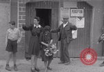 Image of woman welcomes Free French troops with flowers La Haye Du Puits France, 1944, second 47 stock footage video 65675079343