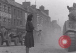Image of woman welcomes Free French troops with flowers La Haye Du Puits France, 1944, second 52 stock footage video 65675079343