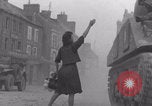 Image of woman welcomes Free French troops with flowers La Haye Du Puits France, 1944, second 54 stock footage video 65675079343
