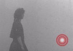 Image of woman welcomes Free French troops with flowers La Haye Du Puits France, 1944, second 60 stock footage video 65675079343