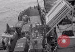 Image of truck lifted to landing craft WW2 France, 1944, second 10 stock footage video 65675079352