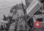 Image of truck lifted to landing craft WW2 France, 1944, second 16 stock footage video 65675079352
