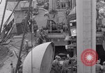 Image of truck lifted to landing craft WW2 France, 1944, second 21 stock footage video 65675079352
