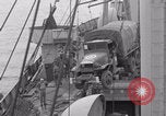 Image of truck lifted to landing craft WW2 France, 1944, second 32 stock footage video 65675079352