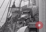 Image of truck lifted to landing craft WW2 France, 1944, second 33 stock footage video 65675079352