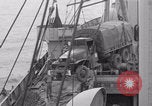 Image of truck lifted to landing craft WW2 France, 1944, second 36 stock footage video 65675079352