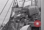 Image of truck lifted to landing craft WW2 France, 1944, second 37 stock footage video 65675079352