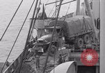 Image of truck lifted to landing craft WW2 France, 1944, second 38 stock footage video 65675079352