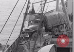 Image of truck lifted to landing craft WW2 France, 1944, second 39 stock footage video 65675079352
