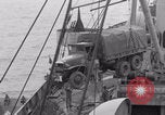Image of truck lifted to landing craft WW2 France, 1944, second 40 stock footage video 65675079352