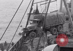Image of truck lifted to landing craft WW2 France, 1944, second 41 stock footage video 65675079352