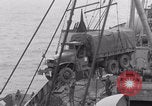 Image of truck lifted to landing craft WW2 France, 1944, second 42 stock footage video 65675079352