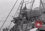 Image of truck lifted to landing craft WW2 France, 1944, second 43 stock footage video 65675079352